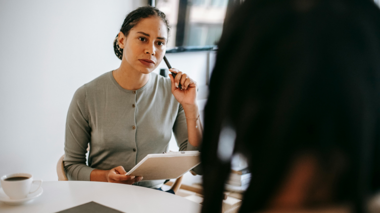 Woman listens to another person who wants to file a complaint.