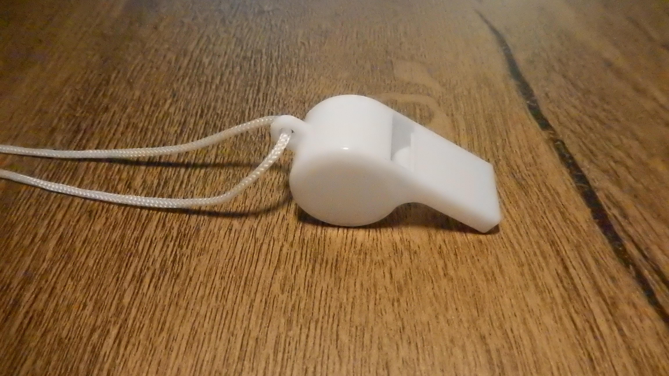 White whistle on a floor